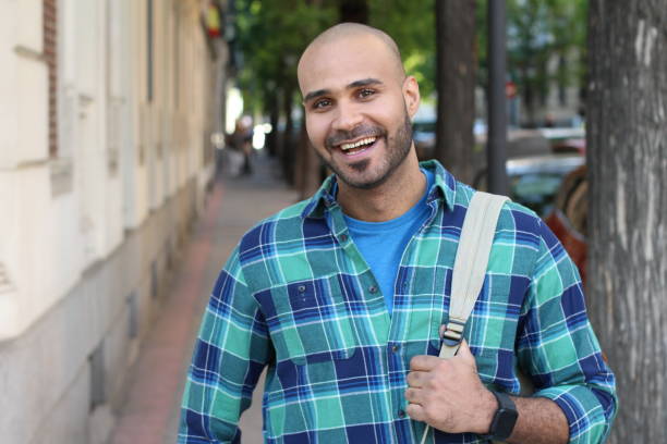 istock Very cute ethnic man on the street 1327681340