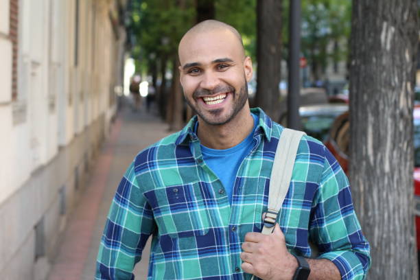 istock Very cute ethnic man on the street 1327681354
