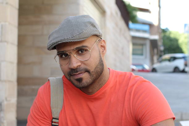 istock Young man with eyeglasses and beret outdoors 1327681390