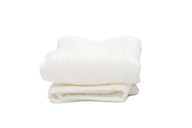 istock White fluffy cotton towel isolated on a white background. 1327682943