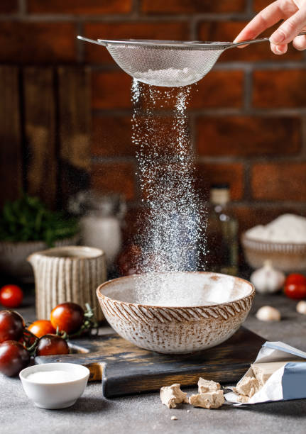 istock Ingredients for making dough for pizza. Making yeast dough 1327684536
