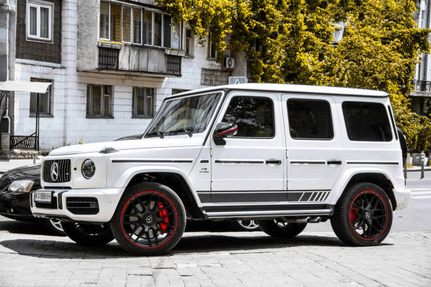 White SUV Mercedes-Benz G500 AMG  parked in the city stock photo