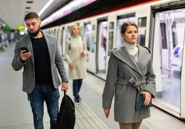 istock Woman is standing on platform and waiting train 1327684762