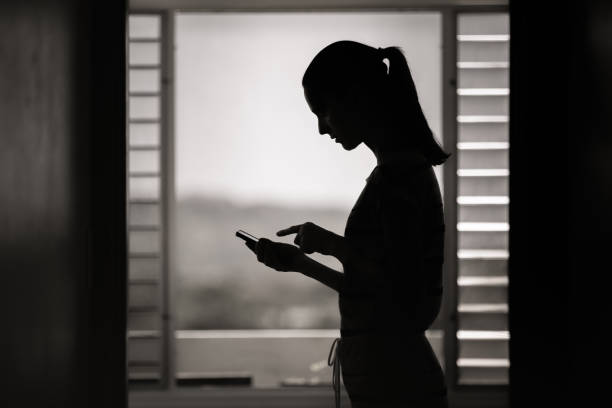 istock Woman using mobile phone at home. 1327685681