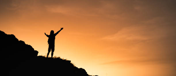 istock Man enjoying view from top of mountain. 1327685722