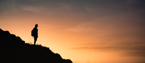 istock Man hiker enjoying view at the mountain top 1327685724
