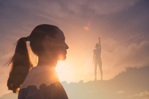 istock Winner. Woman thinking about her successful future. 1327688072