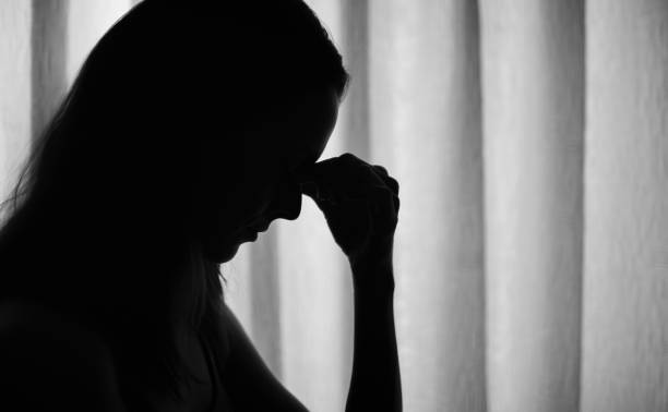 istock Sad woman at home. 1327688074