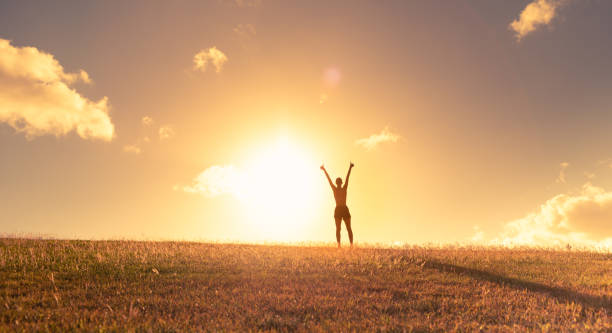 istock Woman enjoying beautiful sunset. 1327688252
