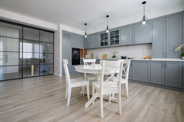 istock Trendy grey and white modern kitchen furniture in studio apartment 1327690218