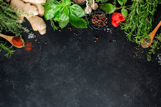 istock Fresh herbs, herbs and spices on a black background with copy space. Culinary concept. 1327691646