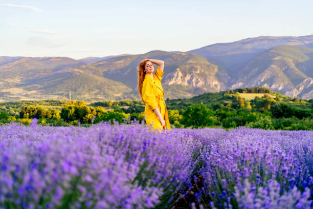 istock Young woman in the lavender field 1327692813