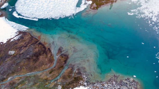 istock Aerial view of a thawing lake 1327693414