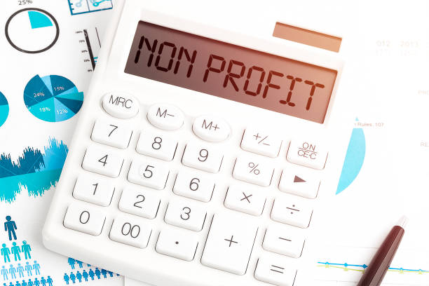 istock Text NON PROFIT on calculating machine. Business concept. Top view. 1327693607