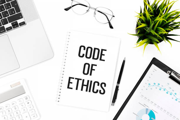 Text CODE OF ETHICS on notebook. Laptop, calculator, clipboard for chart, glasses, pen and plant on office desk. Flat lay, top view. Business concept. Text CODE OF ETHICS on notebook. Laptop, calculator, clipboard for chart, glasses, pen and plant on office desk. Flat lay, top view. Business concept. code of ethics stock pictures, royalty-free photos & images