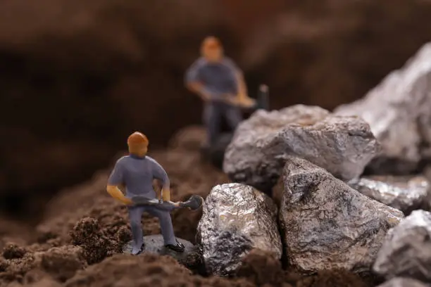 Mining of Cobalt. Miniature worker mining metal zinc and silver. Mining business or Department of Mineral Resources.