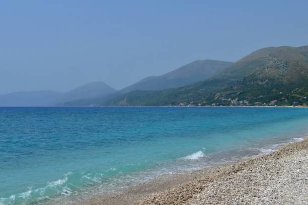 istock Beach and sea on background of mountains 1327693956