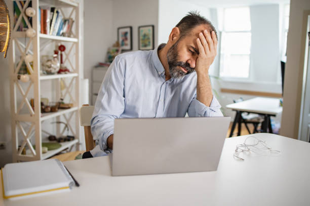 istock Mature man at home, working on the laptop 1327697209