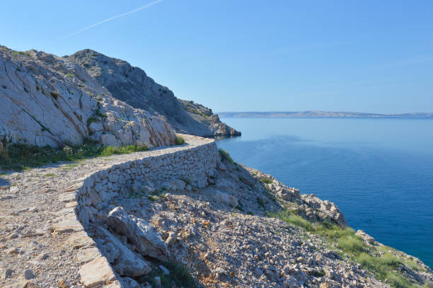 istock Adriatic coastline with walkway by sea at Jablanac 1327697288