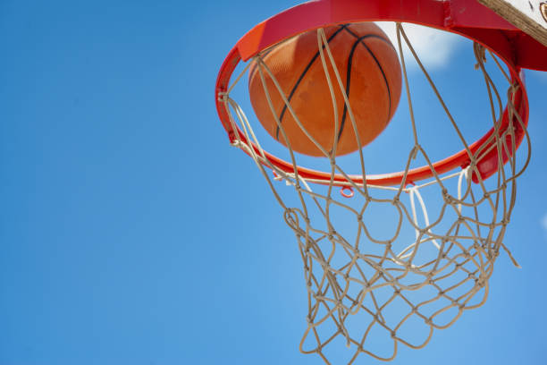 istock A basketball swishes through the net 1327699214