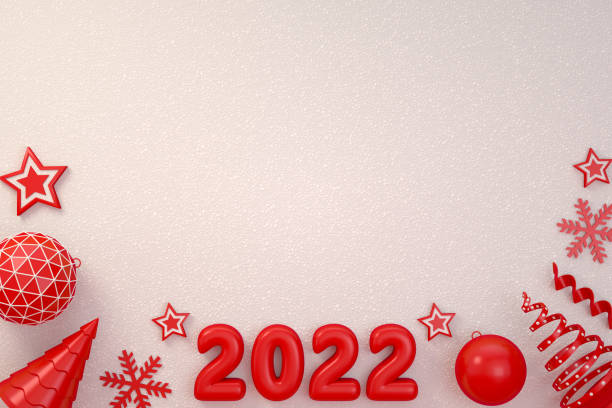 istock 2022 New Year, Christmas Ornaments on White Snow Background 1327700604