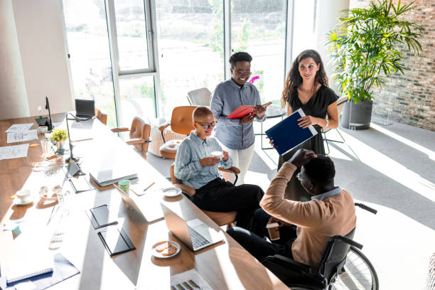 istock Diverse Team of Executives Gathered for Weekly Meeting 1327702521