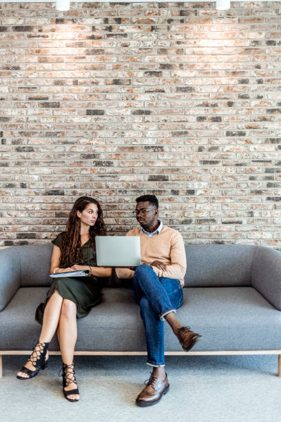 istock Happy business colleagues in modern office 1327702561