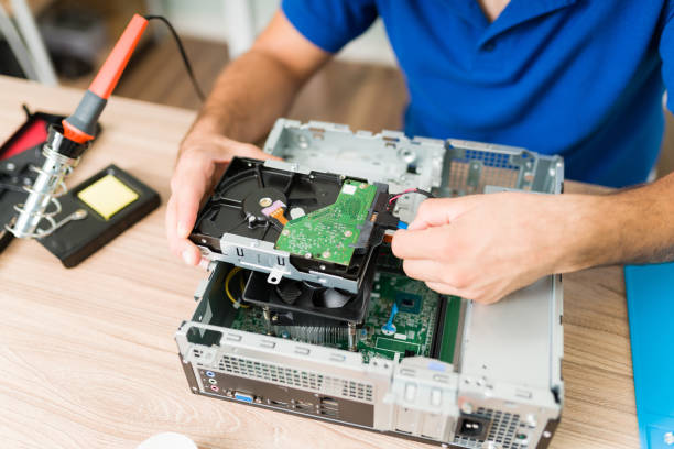 istock Young man installing a new hard drive on an old computer 1327702663