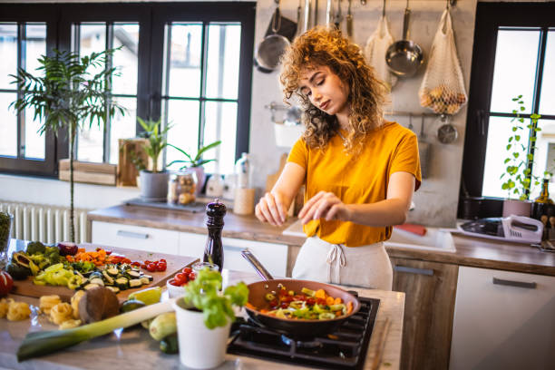 istock Woman cooking vegetables in the kitchen 1327704313