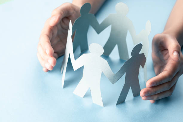 istock Hand Protecting Paper Cut Out Figure 1327704326