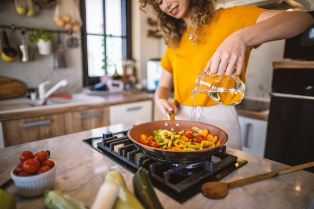 istock Woman cooking vegetables in the kitchen 1327704551