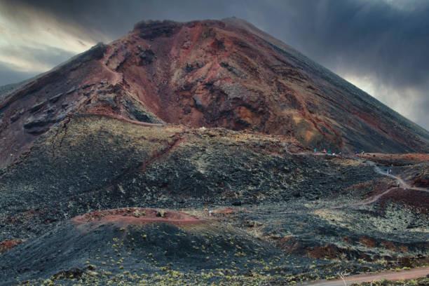 Volcano Teneguía The Teneguía volcano with people walking its paths. Erupted in 1971. la palma canary islands photos stock pictures, royalty-free photos & images