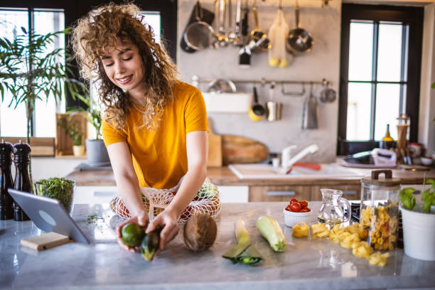 istock Young women making healthy meal in the kitchen 1327705739