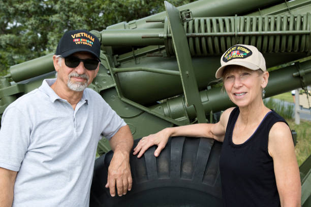 istock Military veterans looking at camera in front of artillery 1327713590