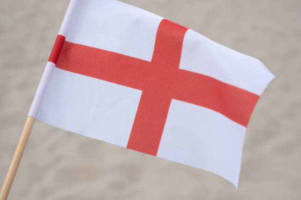 istock English flag waving in wind. 1327716388