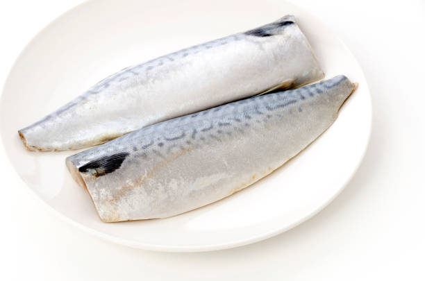 istock Salted fish mackerel fillet on white plate 1327717780