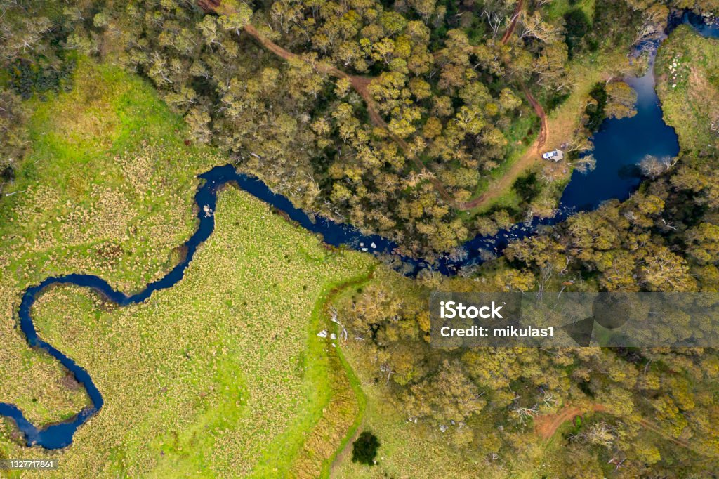 Manning river, Barrington Tops National park Aerial view of a green field and Eucalyptus forest with a four wheel drive camping at the Manning River at Barrington Tops National Park, NSW, Australia New South Wales Stock Photo