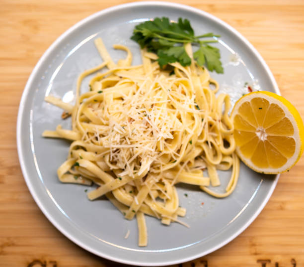 istock Chefs pasta noodles served on a plate with lemon 1327721435