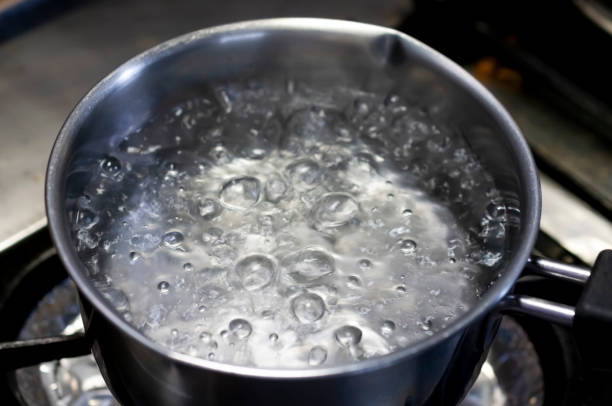 istock Boiling water in stainless pan in kitchen 1327722597