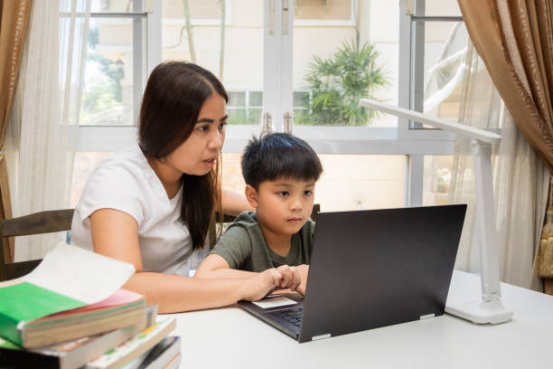 istock A mother is teaching her child from home schooling 1327731665