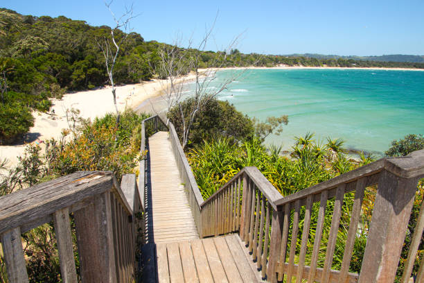 istock Timber stairs going down to the blue ocean and white sandy beach at Byron Bay 1327731899