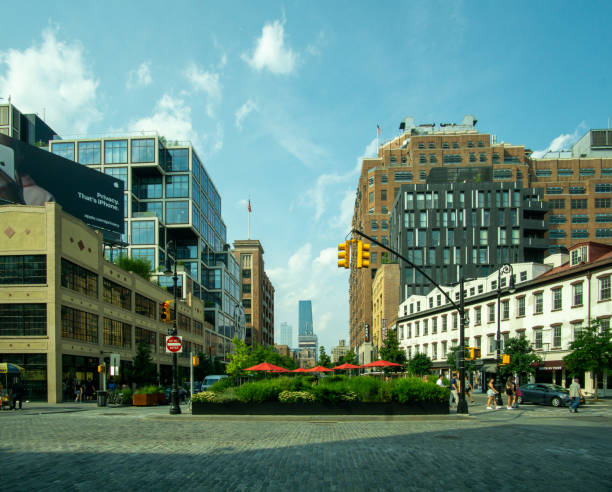 Horizontal view of public space at the intersection of West 14th Street and Ninth Avenue in the Meatpacking District. New York, NY - USA - July 6, 2021: Horizontal view of public space at the intersection of West 14th Street and Ninth Avenue in the Meatpacking District. logan west stock pictures, royalty-free photos & images