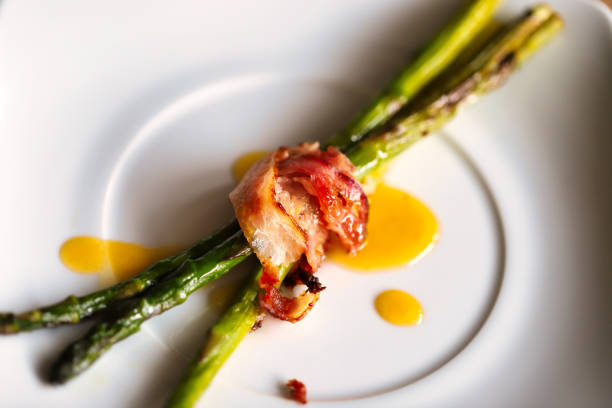istock dish of asparagus with bacon 1327736975