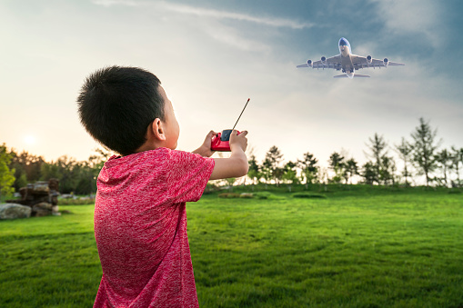 Boy holding a plane