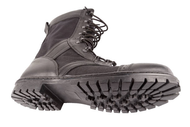 istock new black lightweight military boot isolated on white background, lying on its side 1327740541