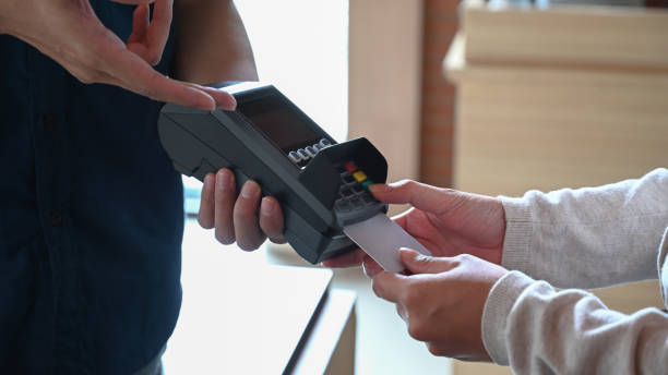 istock Female paying with credit card in restaurant. 1327747645