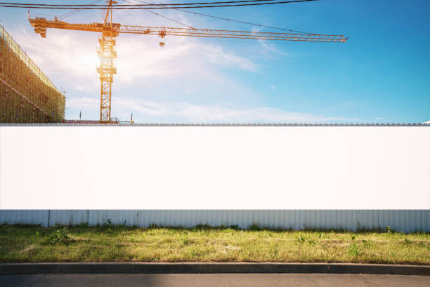 white blank hoarding poster with mockup space on construction site - greed imagens e fotografias de stock