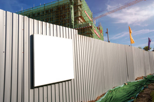 istock Empty white information frame with space for mock up hangs on metal fence 1327747770