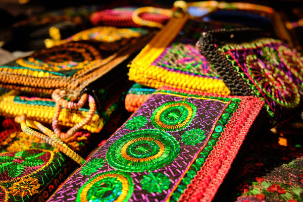 istock Colorful handmade oriental purses on market 1327748670