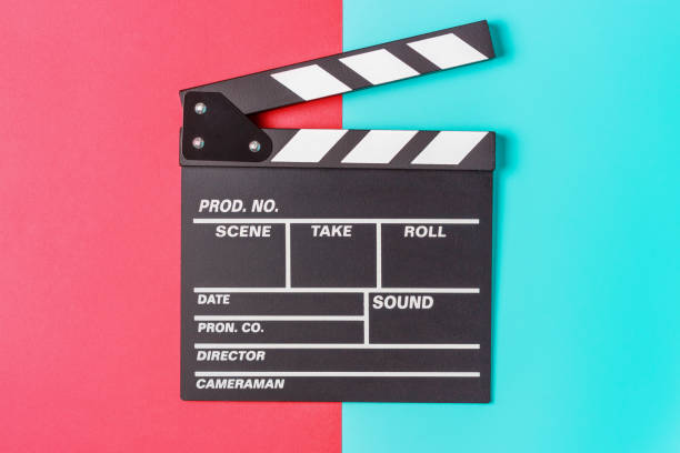 istock The clapperboard on blue and red background close-up, top view. 1327749528